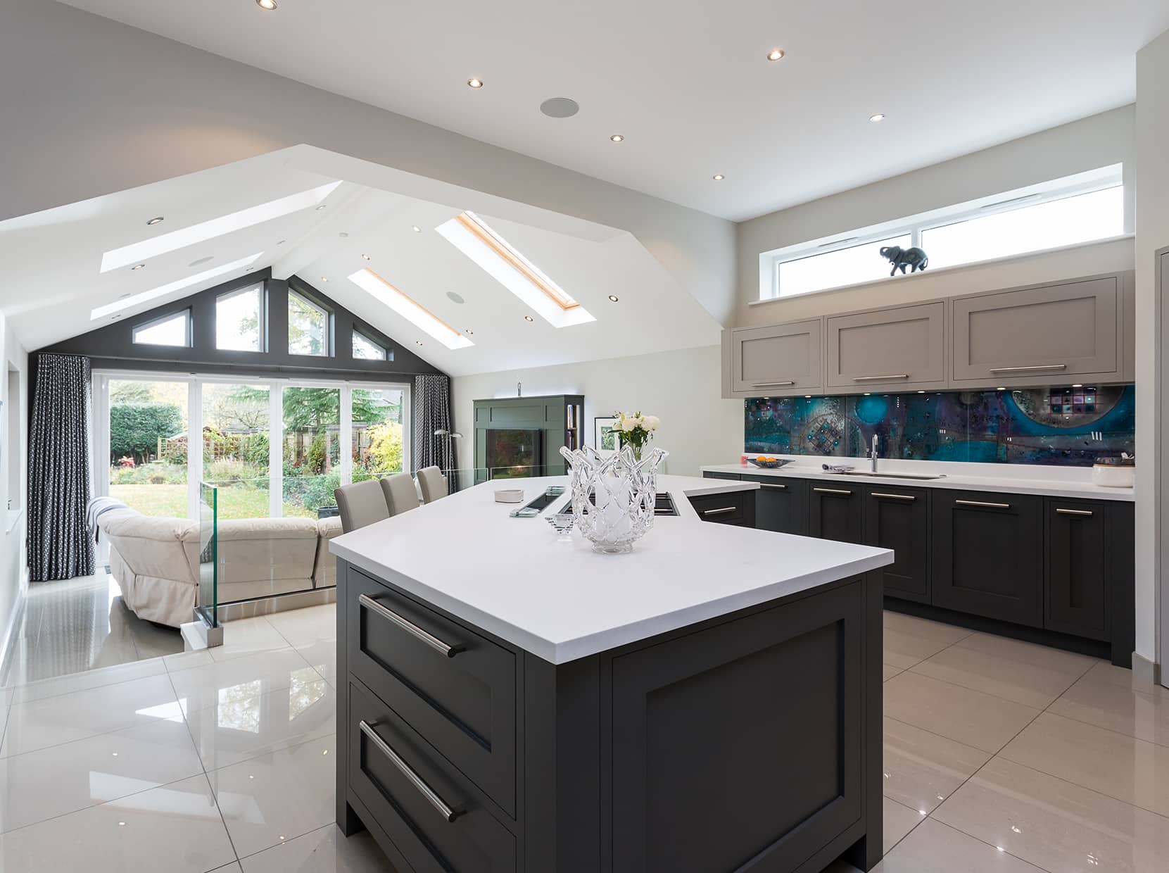a large kitchen with a center kitchen island in the middle of the room.