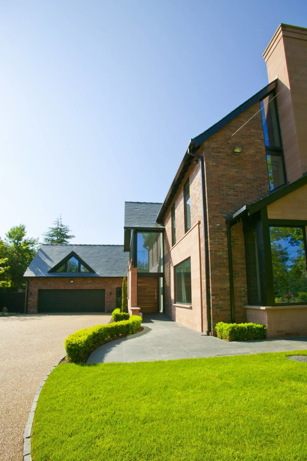 a large house with a driveway in front of it.