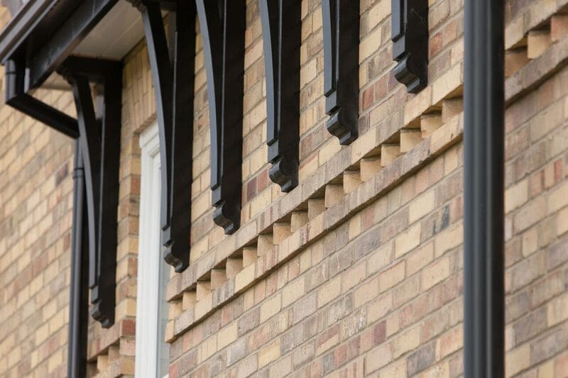 a close up of a brick building with a window.