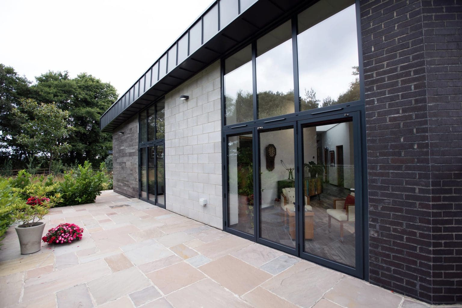 a brick building with a large glass window.