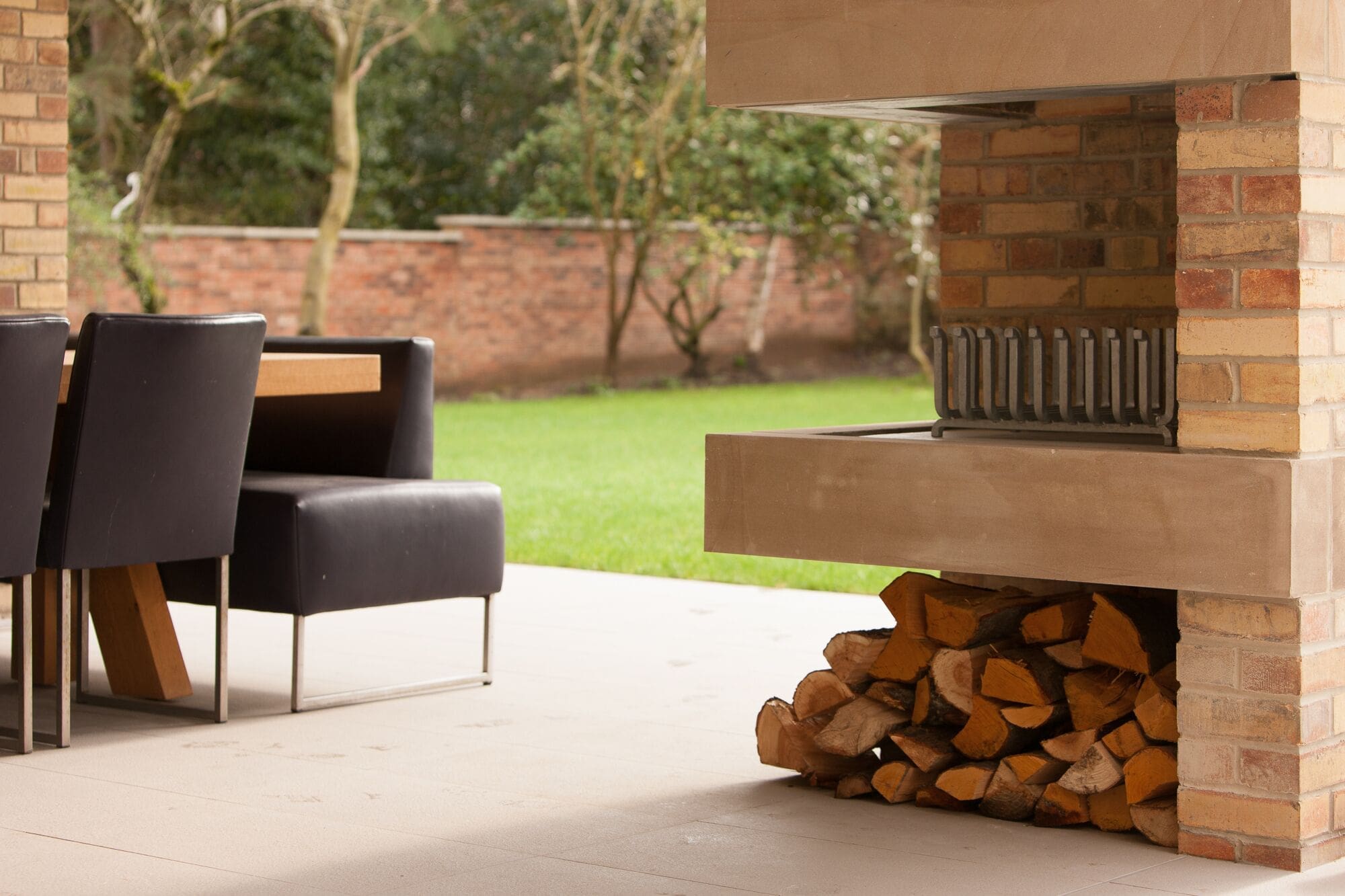 a stack of firewood sitting in front of a fire place.