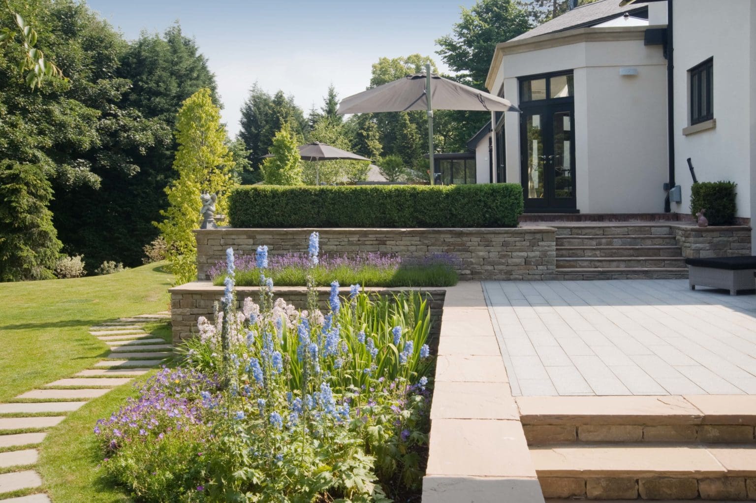 a house with a patio and steps leading to it.