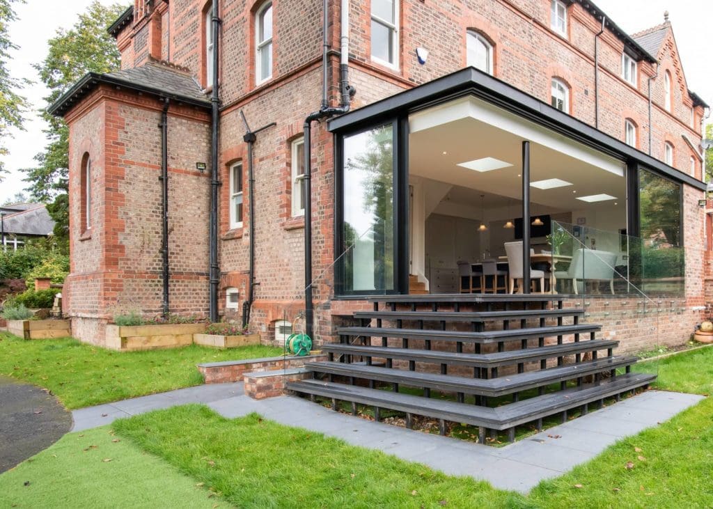 a large brick building with a large glass window.