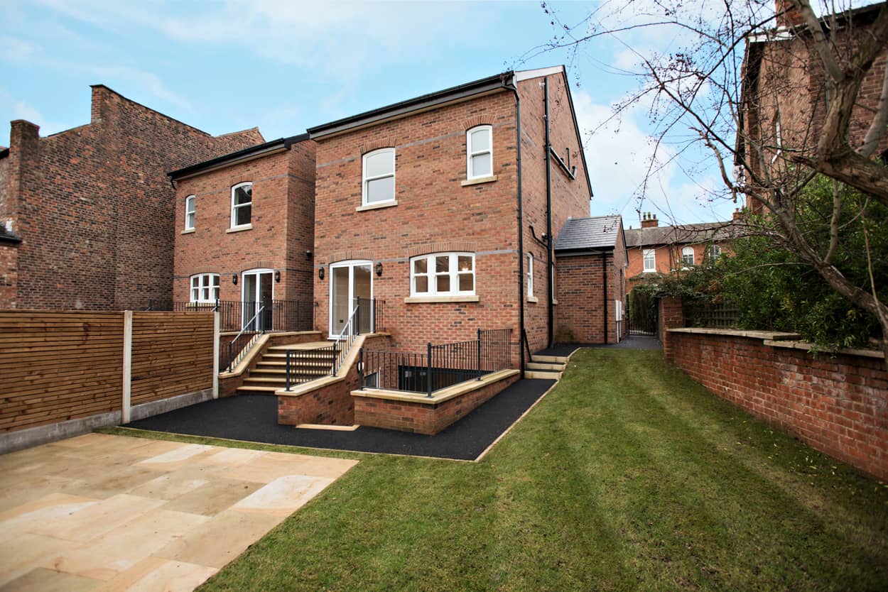 a brick building with steps leading up to it.