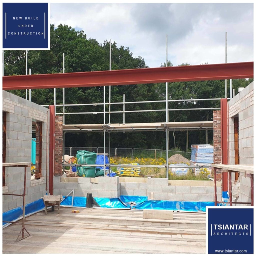 A lakeside property currently undergoing construction of a house.