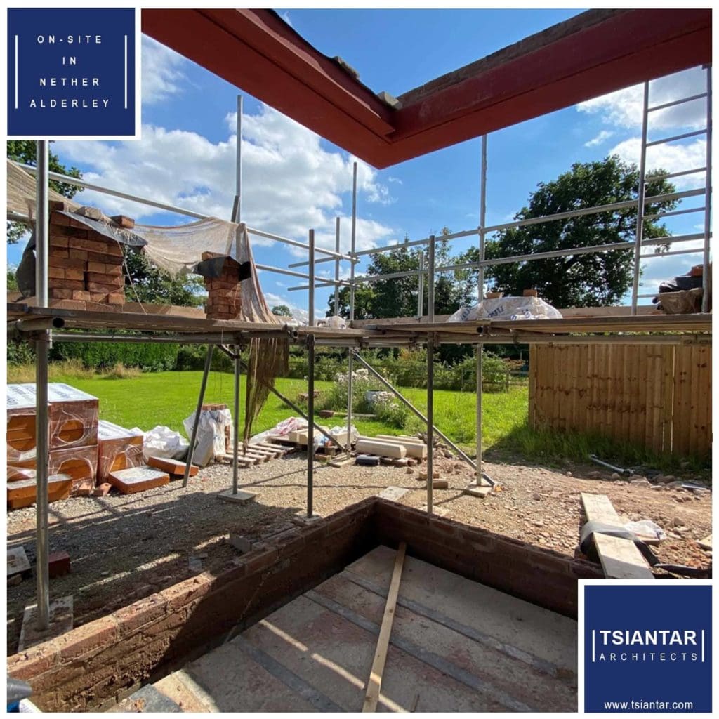 An on-site house under construction with scaffolding in Nether Alderley.