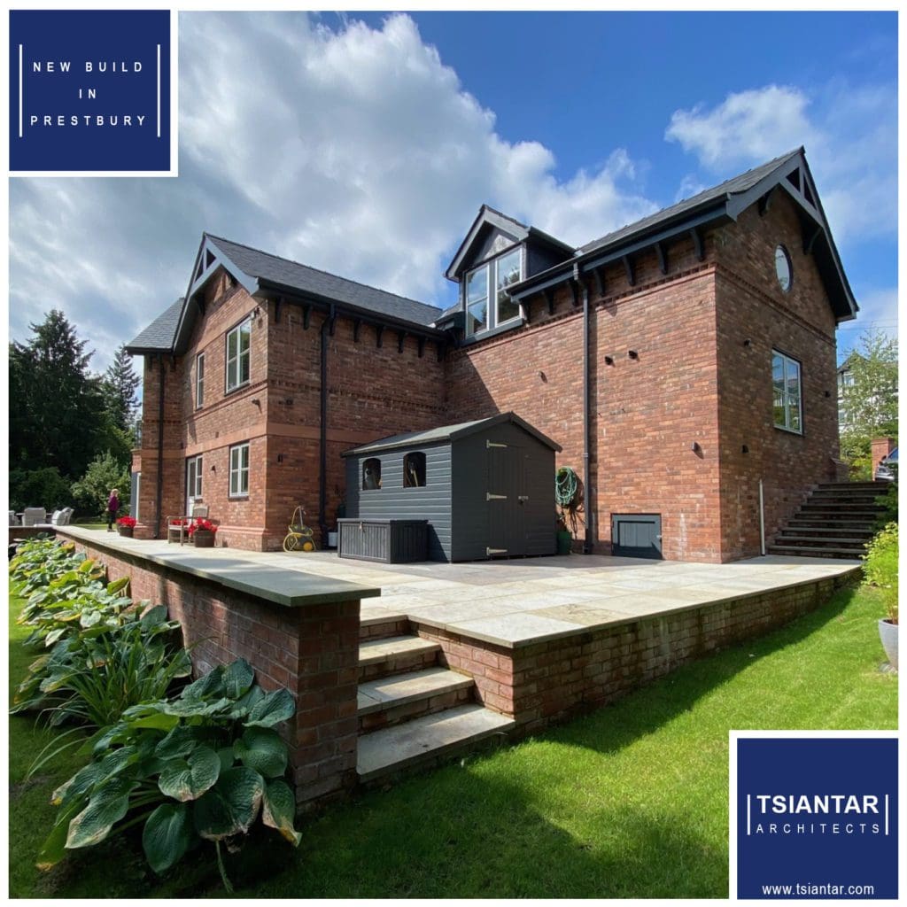 A red brick house with a blue roof located in Cloverdale.