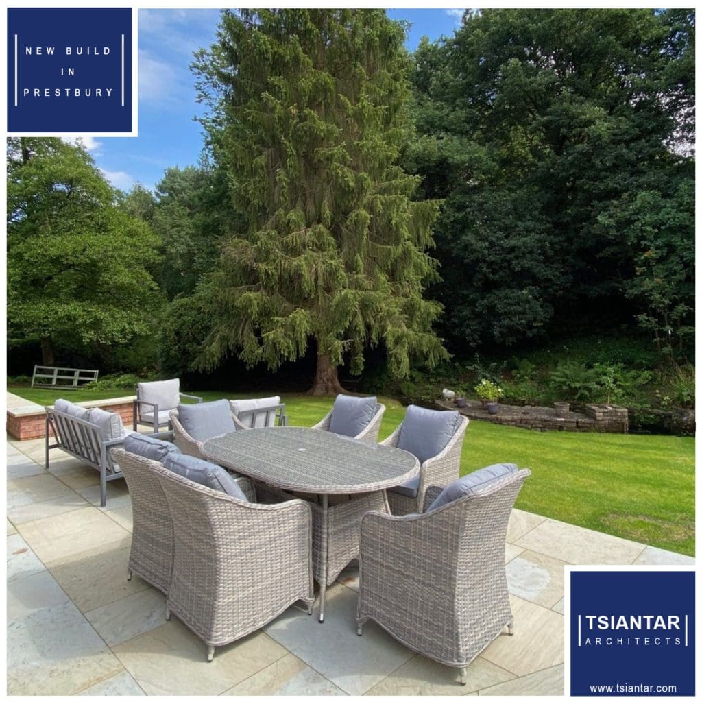 A grey wicker dining set on a patio in Prestbury.