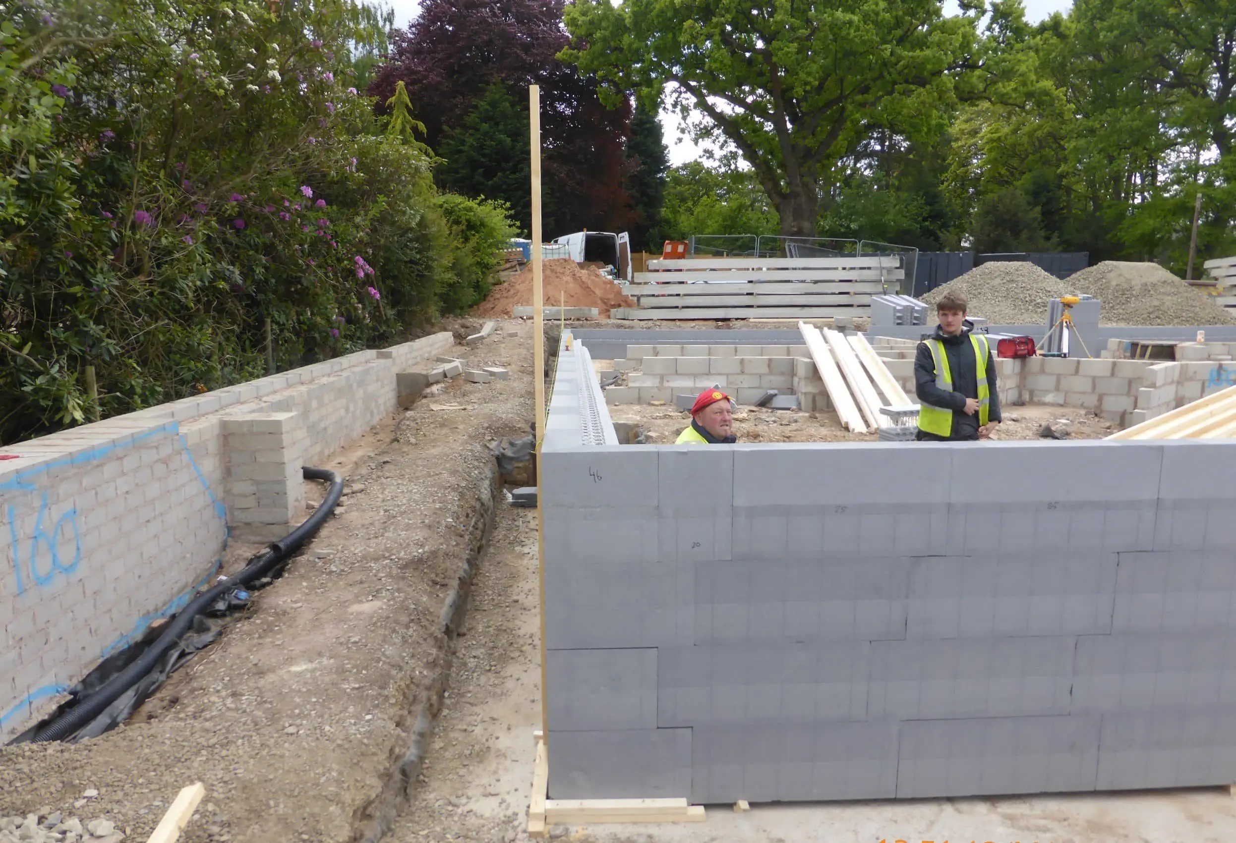A man is working on the construction of a house.