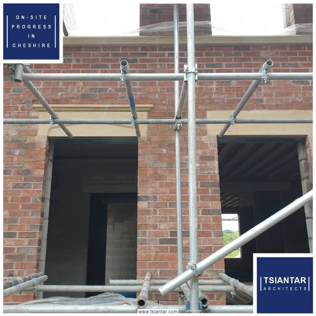 An on-site house with scaffolding on the side of it.