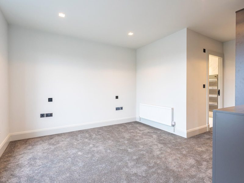 an empty room with a radiator and a radiator.