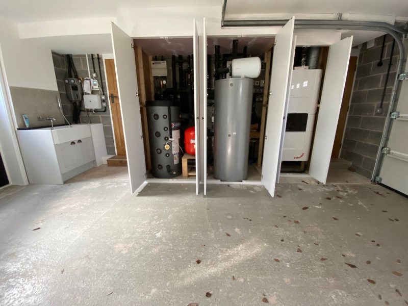 Garage with bank of tanks door open