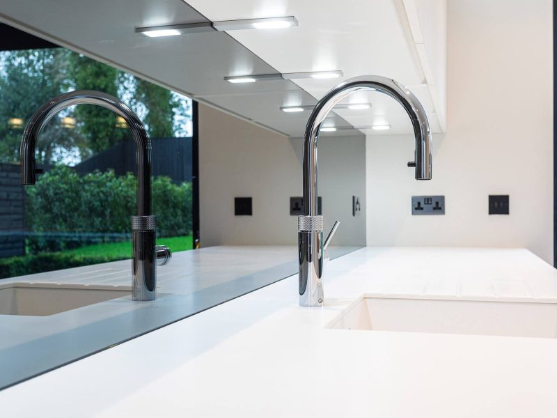 a kitchen with a sink and a large window.
