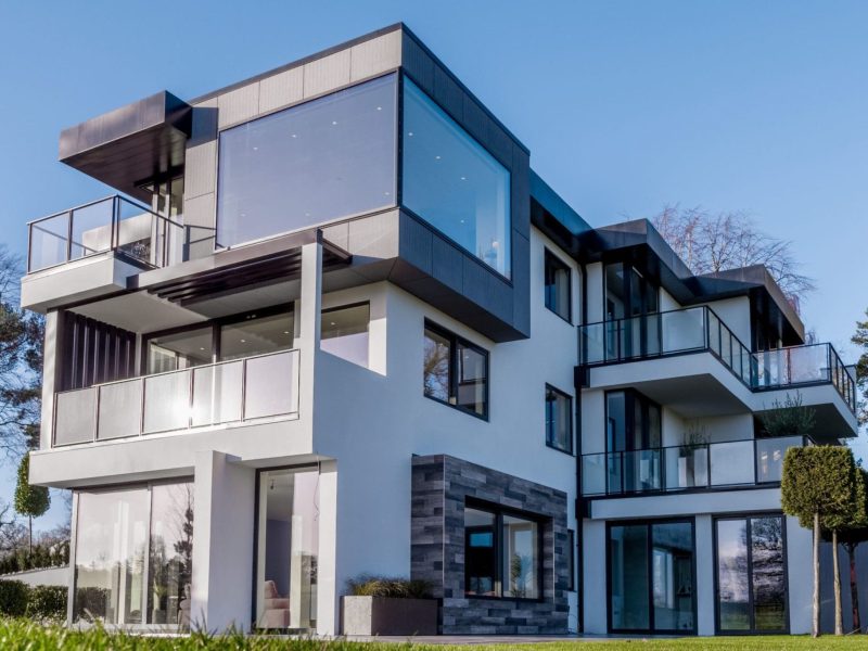 a large white building with balconies and windows.