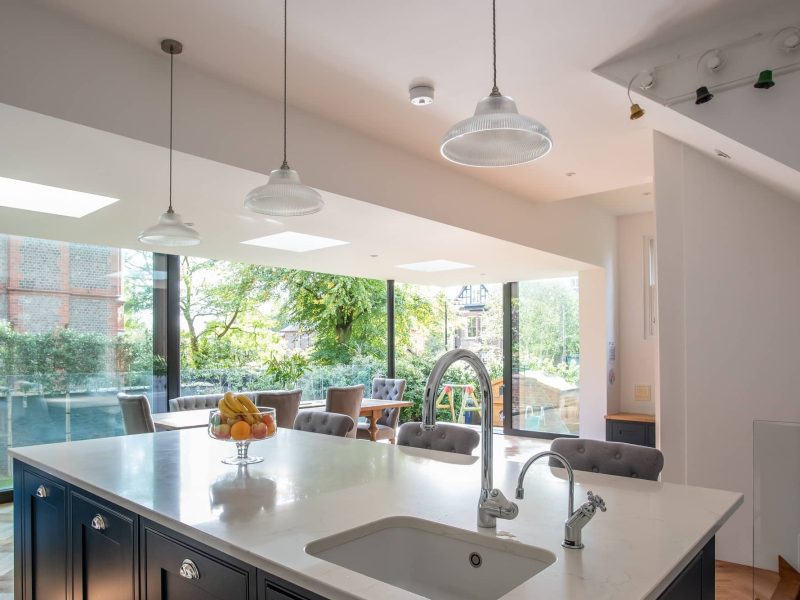 a kitchen with a sink and a large window.