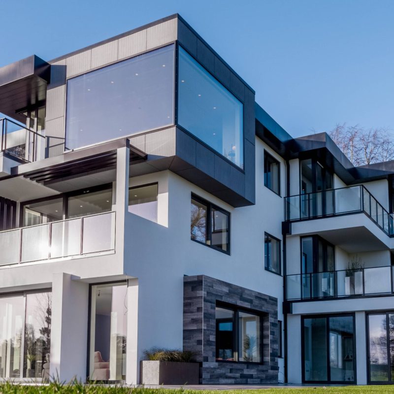 A modern house with glass balconies and balconies.